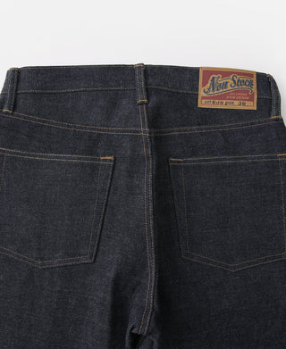 Indigo selvedge denim jeans close-up showing two front pockets and belt loops