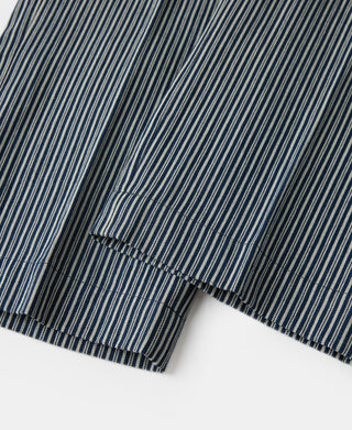 Blue and white striped work pants with stitched cuff hem and side seam.