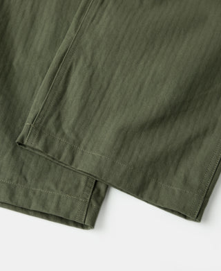 Olive straight-leg pants with double-stitched cuff hem and side seam.