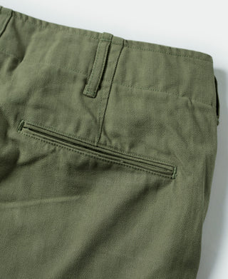 Olive fatigue trousers rear pocket with zipper pocket detail, close-up