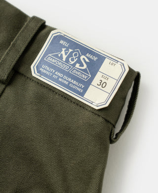 Inside size label on olive cotton twill trousers marked size 30 and lot