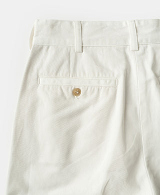 White double-pleat cotton twill trousers with button fly and welt coin pocket