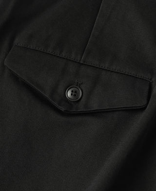 Black cotton twill trouser pocket flap with round button