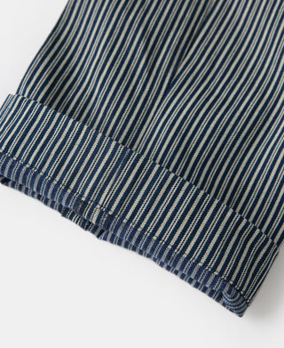 Striped work pants cuff with blue-and-white vertical pinstripes