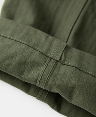 Olive utility pants side seam and reinforced cuff stitching