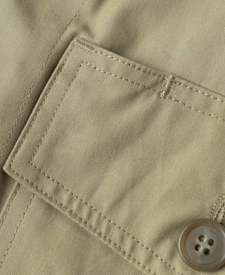 Khaki flight jacket inner pocket with button placket and stitched frame