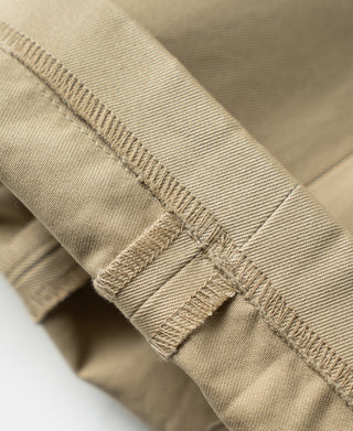 Khaki cotton twill trouser waistband with stitched button placket