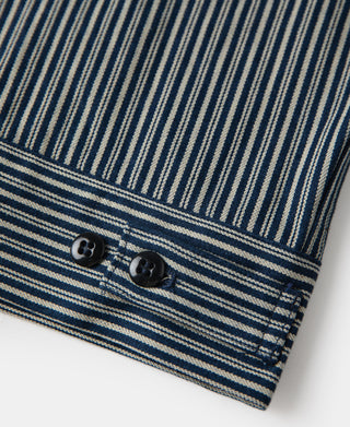 Striped cossack jacket hem with two black buttons and blue-and-cream vertical stripes