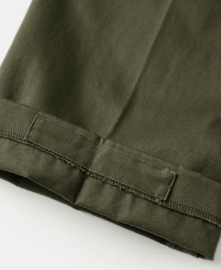 Olive cotton twill trousers with cuffed hem and contrast-stitched seam line