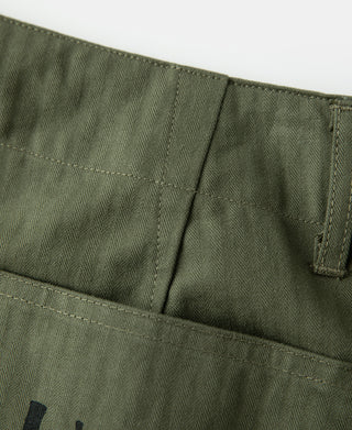 Olive utility pants waistband with interior pleats and belt loops