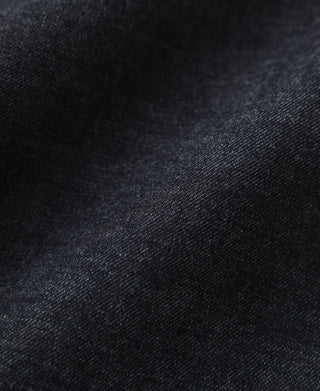 Prewashed indigo selvedge denim fabric close-up with fine texture
