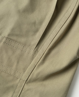 Khaki flight jacket pocket area with curved flap seam stitching