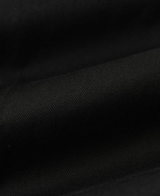 Black cotton twill fabric texture with smooth woven grain