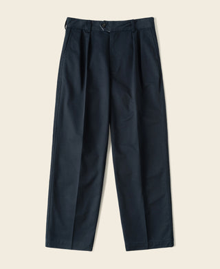 Navy cotton twill trousers with double pleats, button waistband, and straight legs