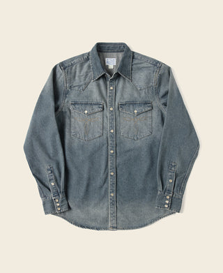 Blue slub denim western shirt with pointed yoke, snap buttons, and two chest pockets