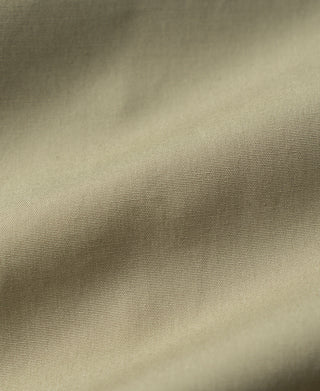 Khaki flight jacket fabric texture close-up, smooth woven surface