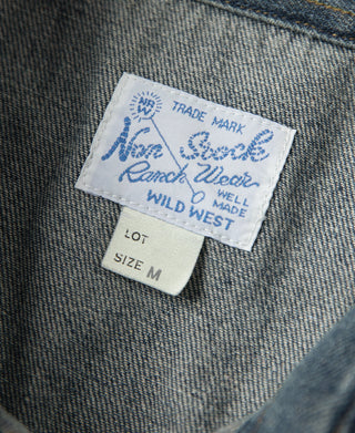 Denim shirt label tag with size M and brand marks