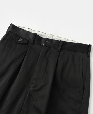 Black single-pleat cotton twill trousers, close-up of waistband and front