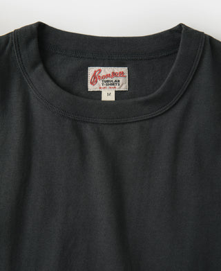 Loopwheel TUBULAR logo tag on dark crew-neck athletic T-shirt.
