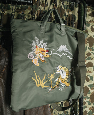 Olive embroidered tote bag hanging with dragon and tiger front embroidery