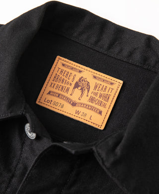Black denim jacket inner collar label with wear it for work and casual text