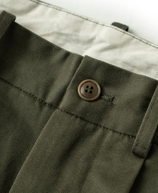 Olive trousers buttoned pocket flap detail and bartack stitching