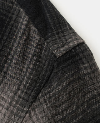 Ombre check brushed cotton fabric with visible weave and seam lines