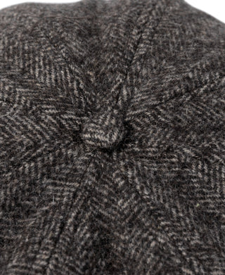 Dark gray herringbone wool cap top with center pinch seam detail.
