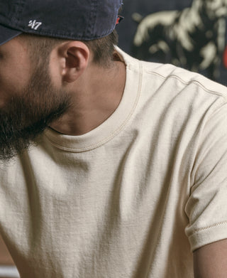 Apricot athletic T-shirt crew neck and shoulder seam close-up