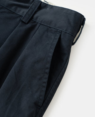 Navy cotton twill trousers showing pleat seam and deep front pocket