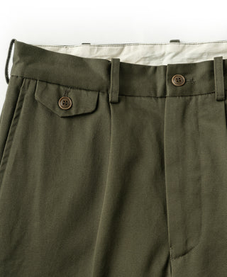 Olive cotton twill trousers with pleats, belt loops, and button pocket flaps
