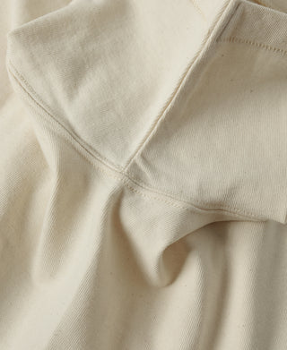 Apricot athletic T-shirt shoulder seam and crew neck collar detail