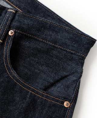 Indigo denim jeans front coin pocket with copper-tone button