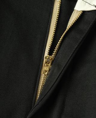 Black trousers with IDEAL zipper and close-up of zipper tape