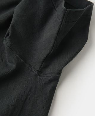 Dark athletic T-shirt sleeve cuff and underarm seam detail.