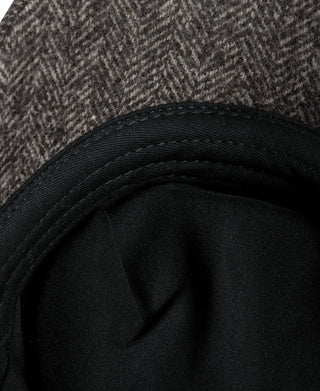 Dark gray newsboy cap with black inner band and smooth satin-like lining.