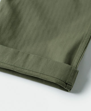 Olive fatigue trousers cuff hem stitching, close-up