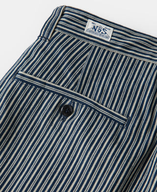 Striped work pants with yoke panel and single button at back.