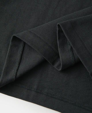 Dark ribbed collar and neckline binding on tubular athletic T-shirt.