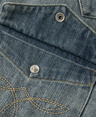 Blue slub denim western shirt yoke seam with snap buttons and topstitched pocket