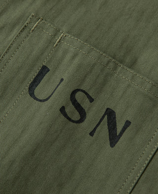 Olive jacket fabric with large USN lettering on chest