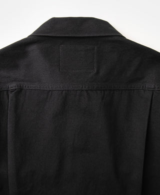 Black denim jacket upper back with clean yoke seam detail