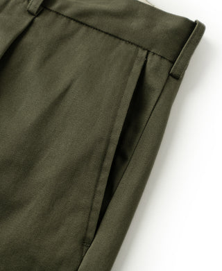 Olive cotton twill trouser leg with side seam and waistband pleat crease