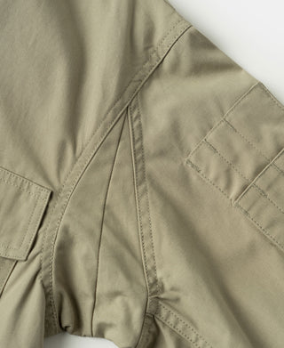 Khaki flight jacket sleeve placket and seam detail with interior stitching