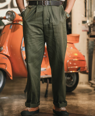 Olive cotton twill trousers on model with belt loops and straight leg shape