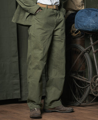Olive utility pants with cuffed hems and belt; straight cargo style