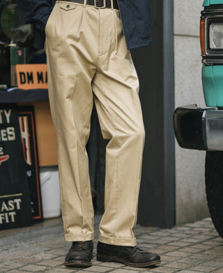 Khaki single-pleat cotton twill trousers front view with crease details