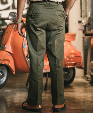 Olive cotton twill trousers with single pleat, belt loops, front button and slant pockets